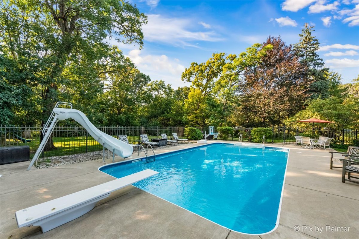 4915 Terra Cotta Road Crystal Lake, IL 60012 - Photo 54 of 93 a view of swimming pool with sitting area and slide