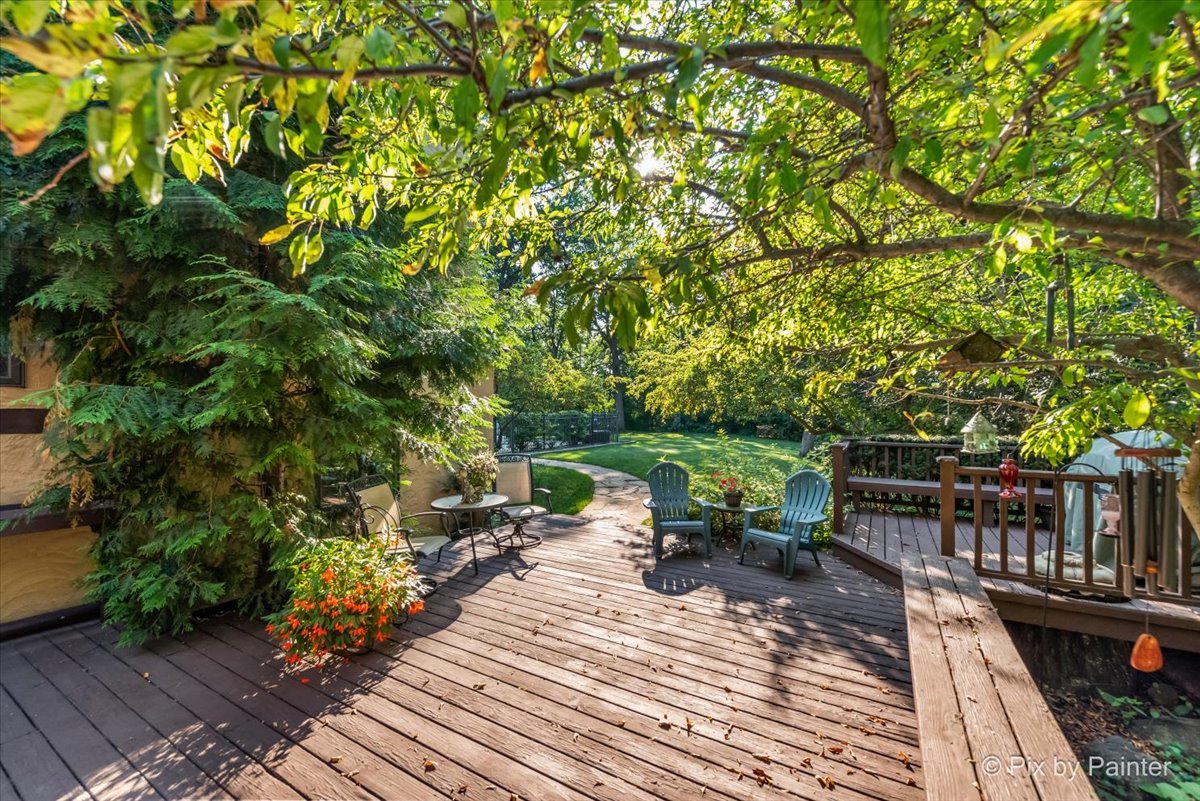 4915 Terra Cotta Road Crystal Lake, IL 60012 - Photo 65 of 93 a view of a patio with table and chairs potted plants with wooden floor