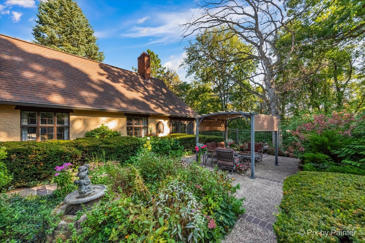 4915 Terra Cotta Road Crystal Lake, IL 60012 - Photo 77 of 93 a front view of a house with a garden