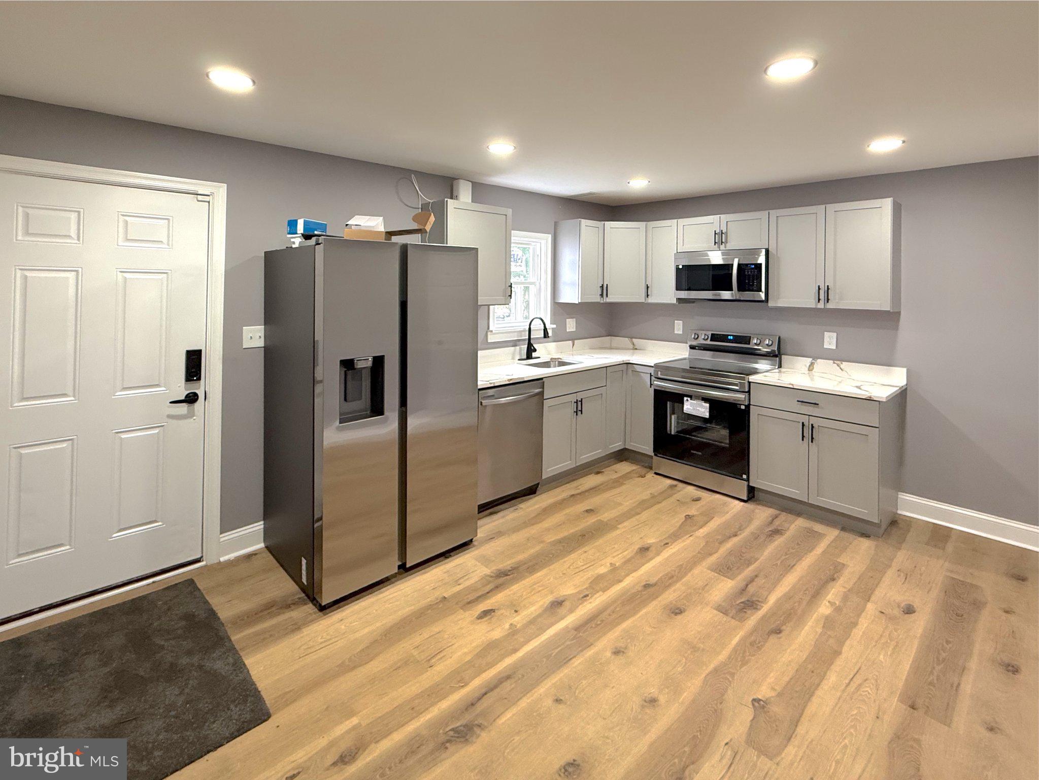 3703 6th Street, Unit 2 Baltimore, MD 21225 - Photo 4 of 20 Modern kitchen with sleek finishes.