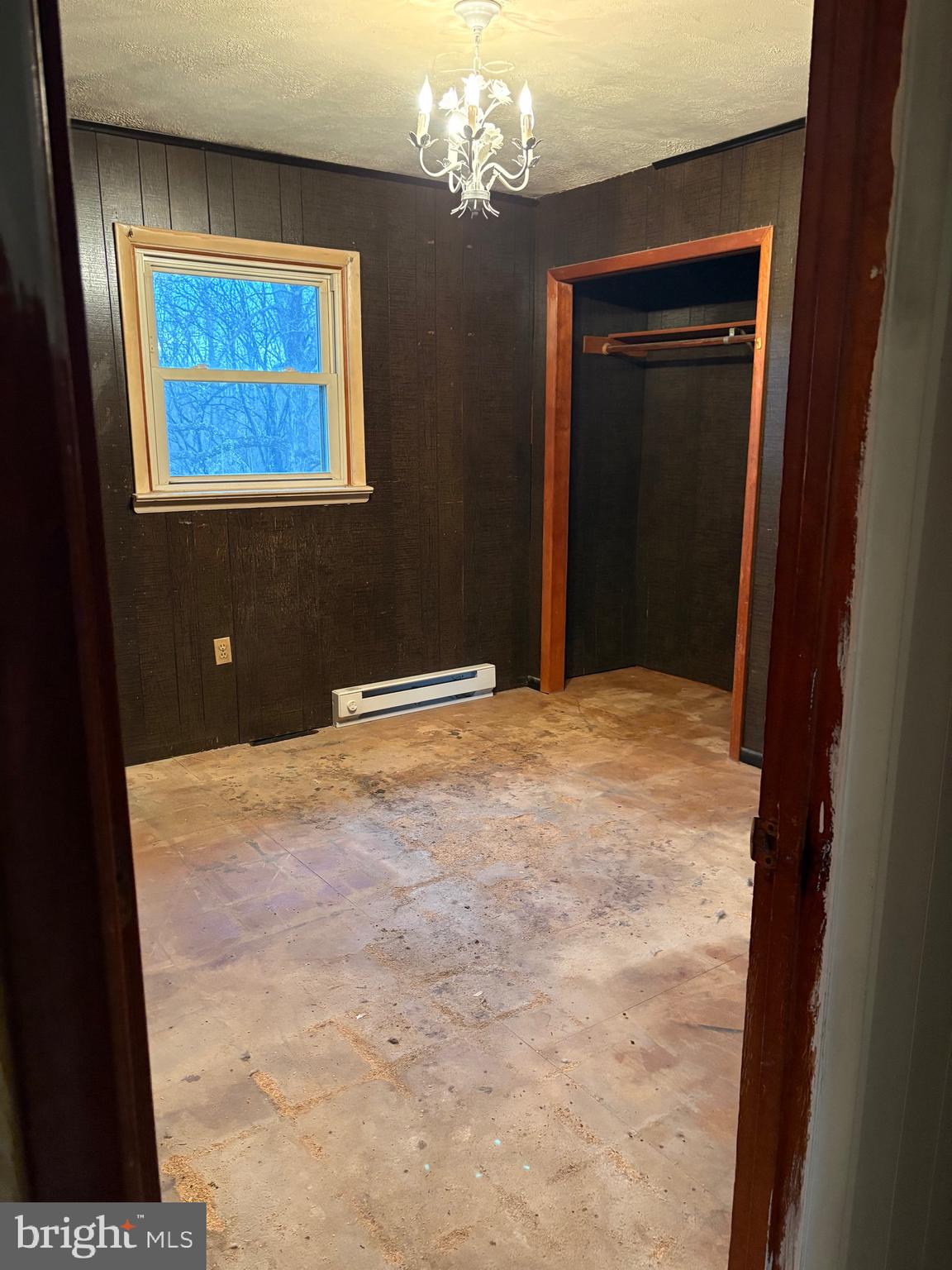 2385 Allensville Road Hedgesville, WV 25427 - Photo 12 of 24 a view of a livingroom with a chandelier