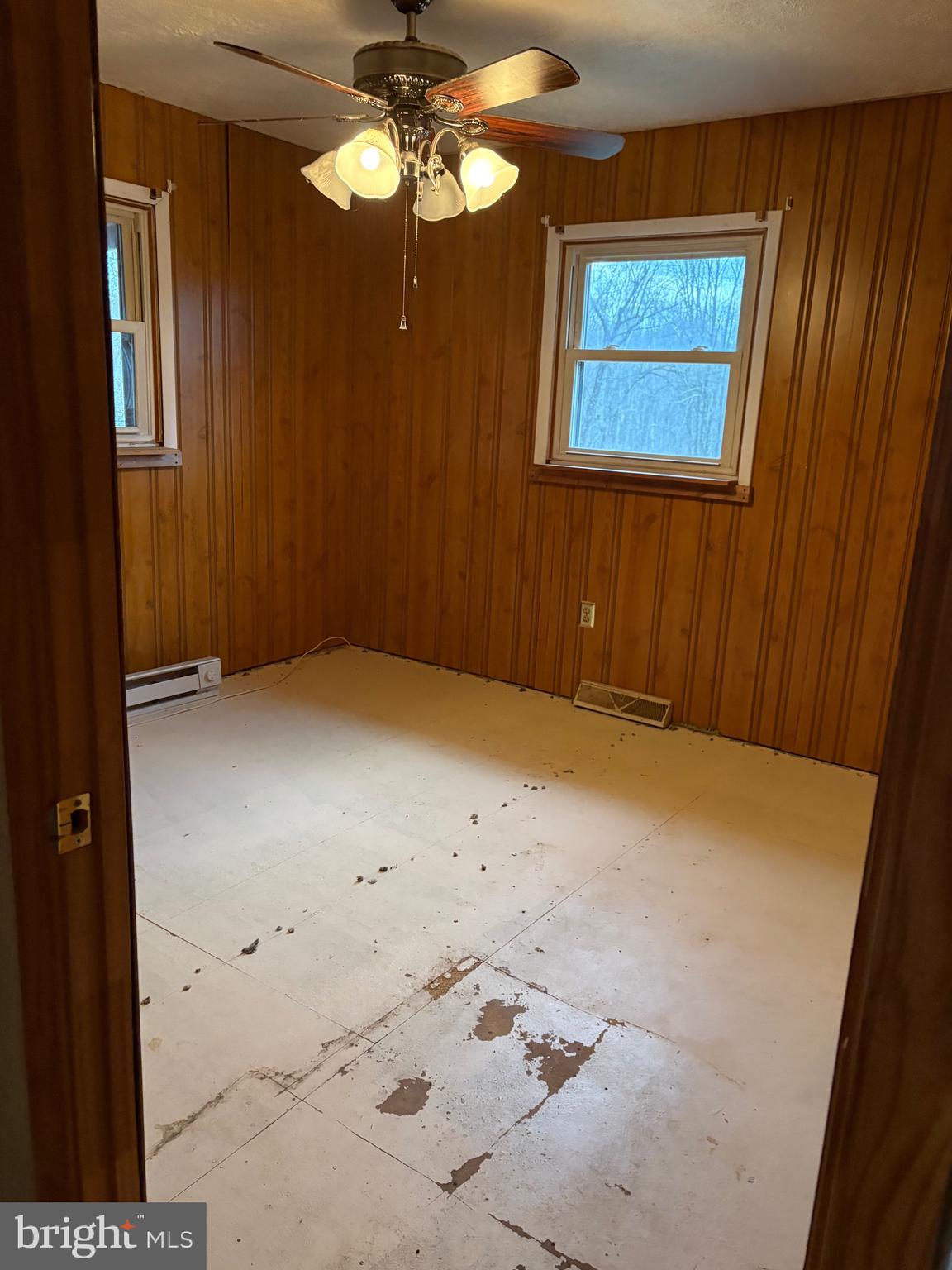 2385 Allensville Road Hedgesville, WV 25427 - Photo 10 of 24 en empty room with fan and window