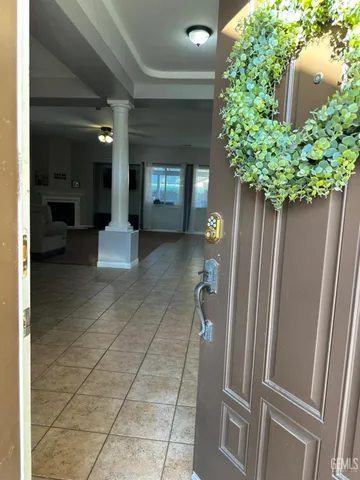 a hallway with table and chairs