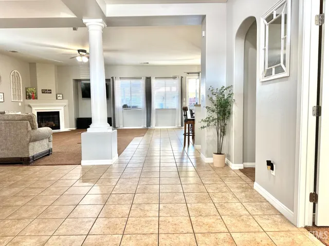 a lobby with furniture and a fireplace