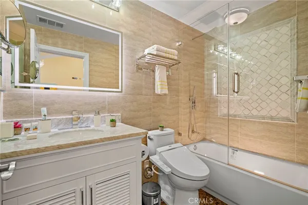 a bathroom with a granite counter top