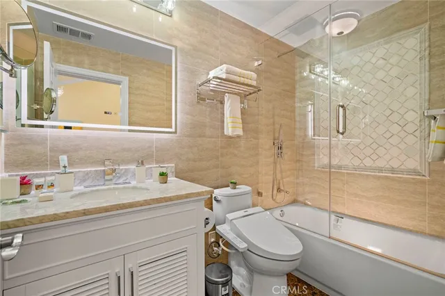 a bathroom with a granite counter top