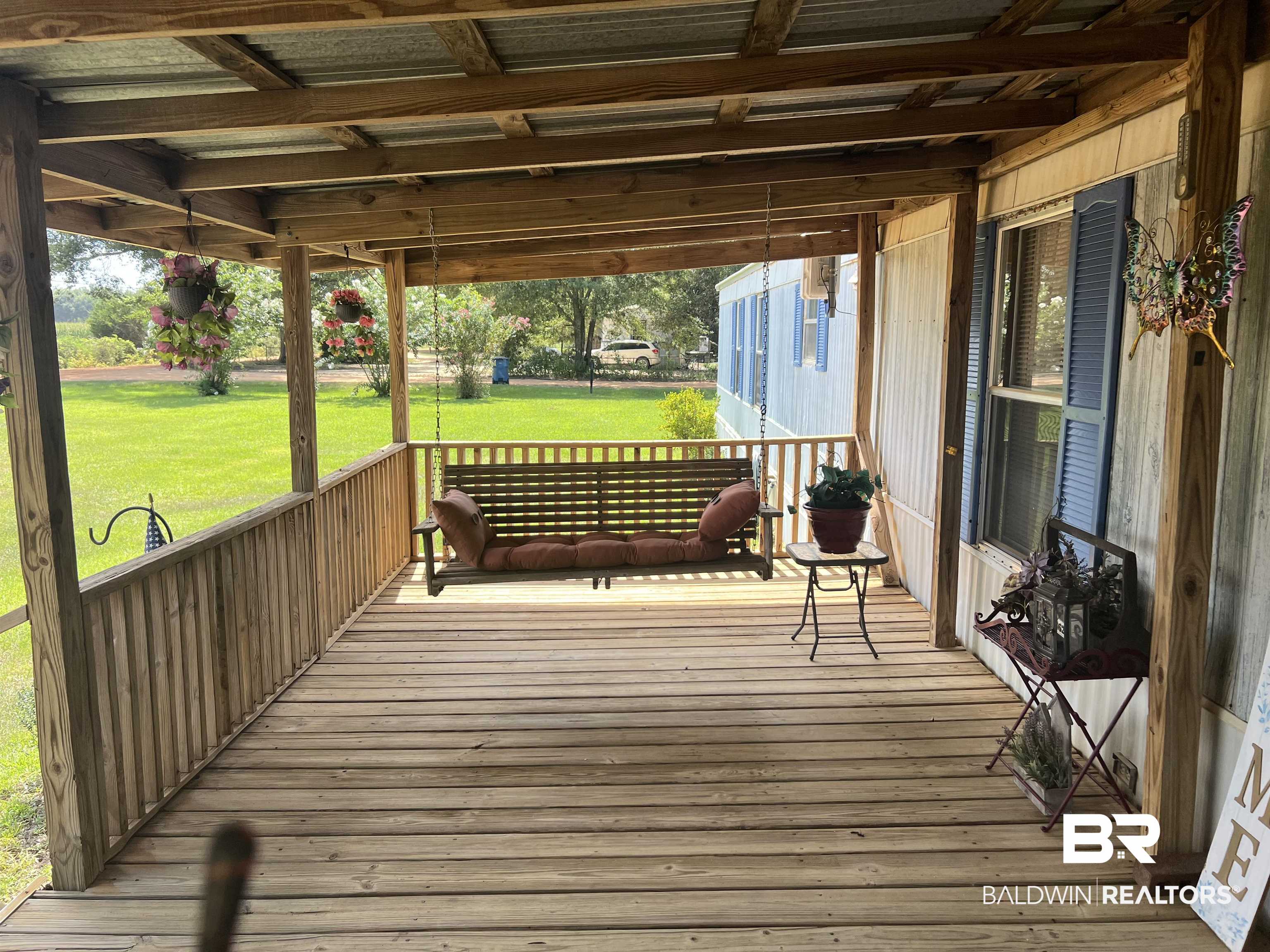 1177 McMillan Road Monroeville, AL 36460 - Photo 2 of 21 Wooden terrace featuring a lawn