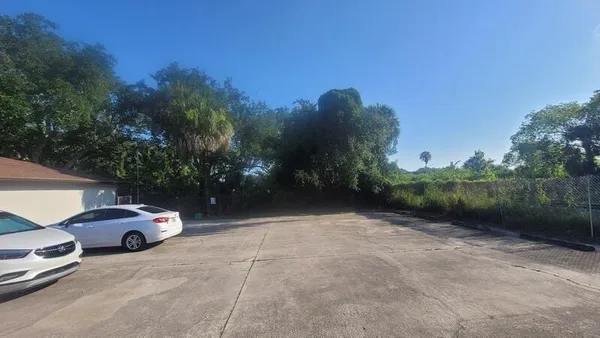 a view of a car parked on the side of a road