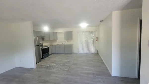 a view of kitchen with wooden floor