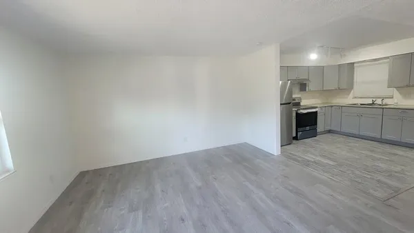 a view of kitchen with wooden floor