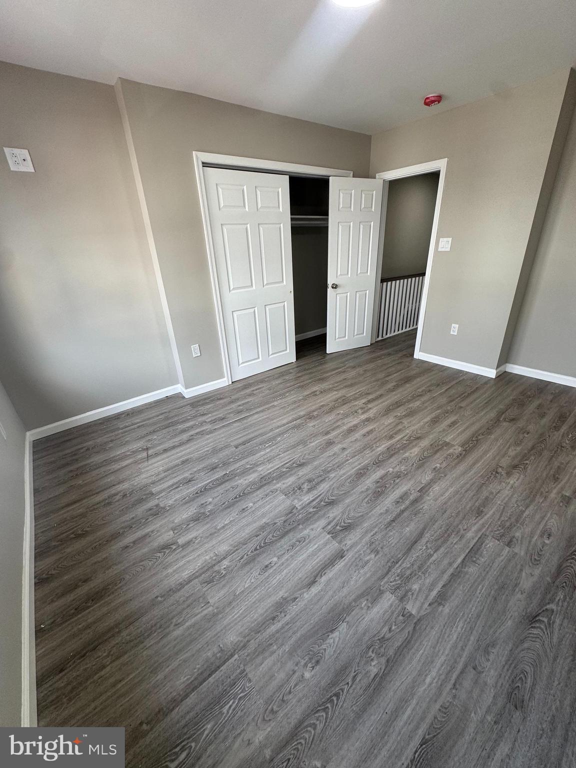6018 Ross Street Philadelphia, PA 19144 - Photo 7 of 14 wooden floor in an empty room with a window