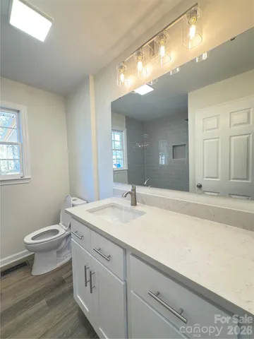 a bathroom with bathtub and shower
