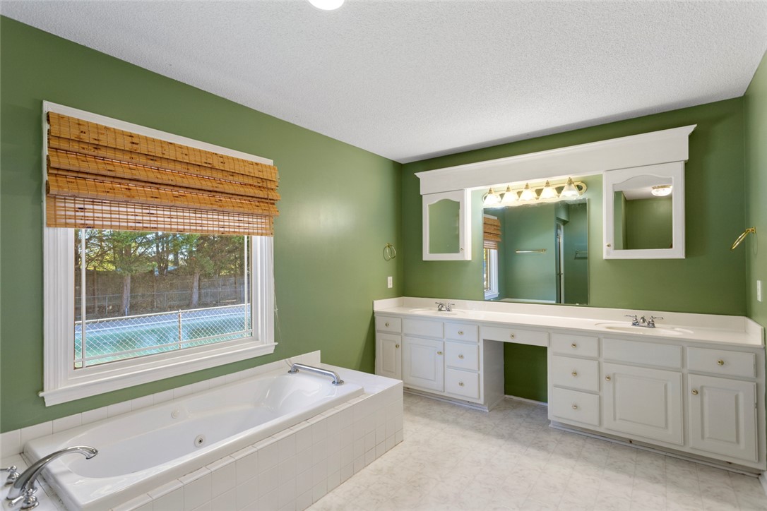 108 Ora Lane Anderson, SC 29625 - Photo 17 of 40 This serene bathroom offers a spacious soaking tub and dual vanity, perfect for unwinding.