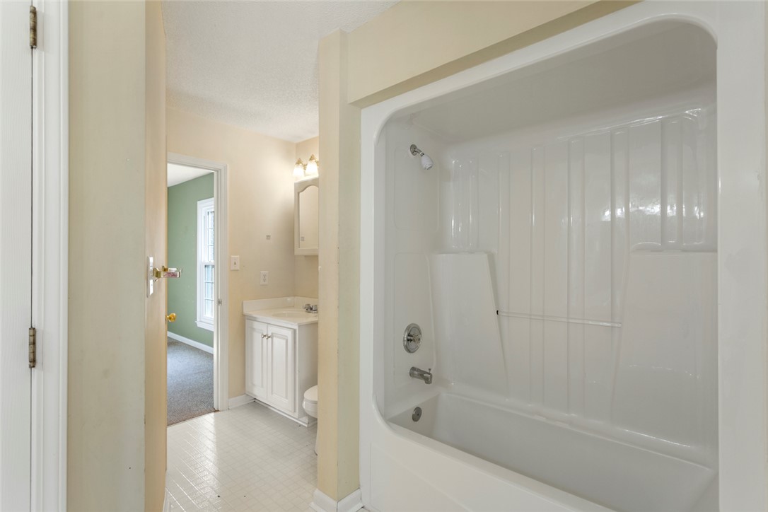 108 Ora Lane Anderson, SC 29625 - Photo 21 of 40 This bathroom features practical design elements with tile flooring and a functional tub and shower combination.