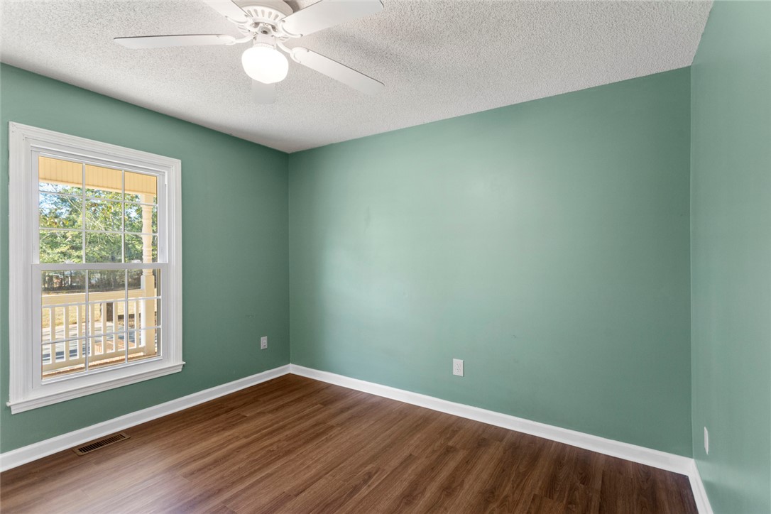108 Ora Lane Anderson, SC 29625 - Photo 23 of 40 This spacious room features ample natural light and durable flooring, perfect for versatile living.