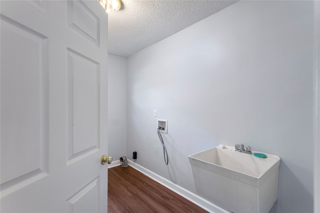 108 Ora Lane Anderson, SC 29625 - Photo 27 of 40 This laundry room features ample space and a utility sink for practical chores.