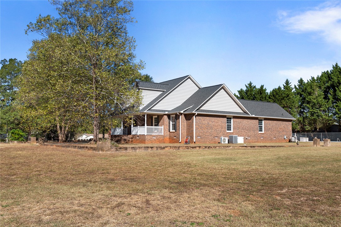 108 Ora Lane Anderson, SC 29625 - Photo 3 of 40 This classic brick residence features a welcoming covered porch, offering tranquil views of the expansive yard.
