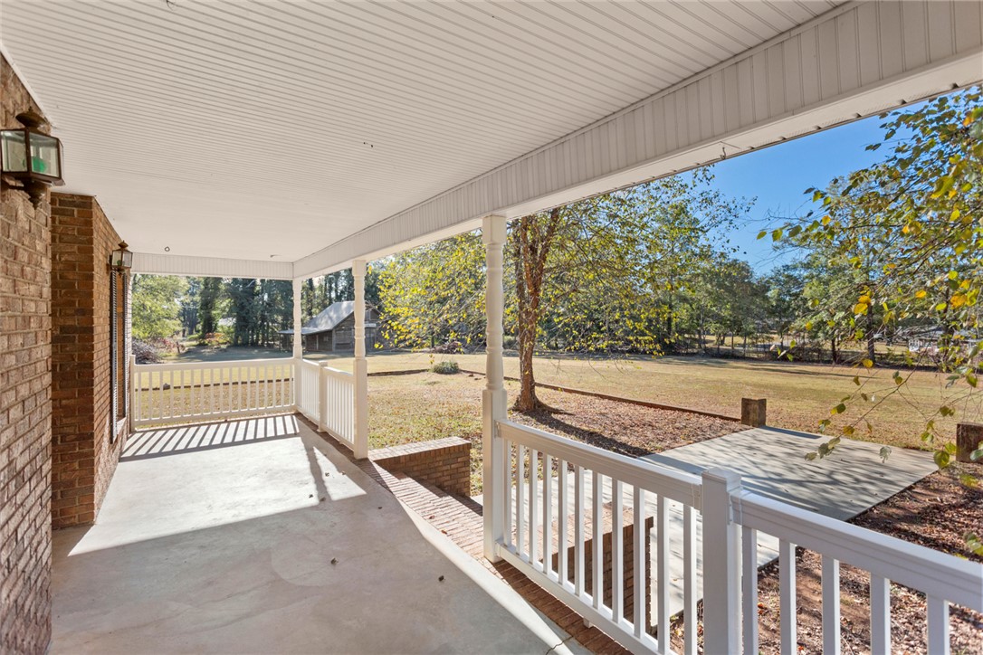 108 Ora Lane Anderson, SC 29625 - Photo 32 of 40 This inviting porch offers tranquil views of the expansive yard.