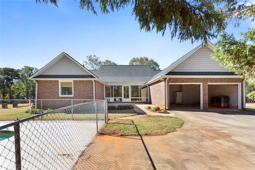 108 Ora Lane Anderson, SC 29625 - Photo 35 of 40 This classic brick residence features an attached garage and a welcoming front facade.