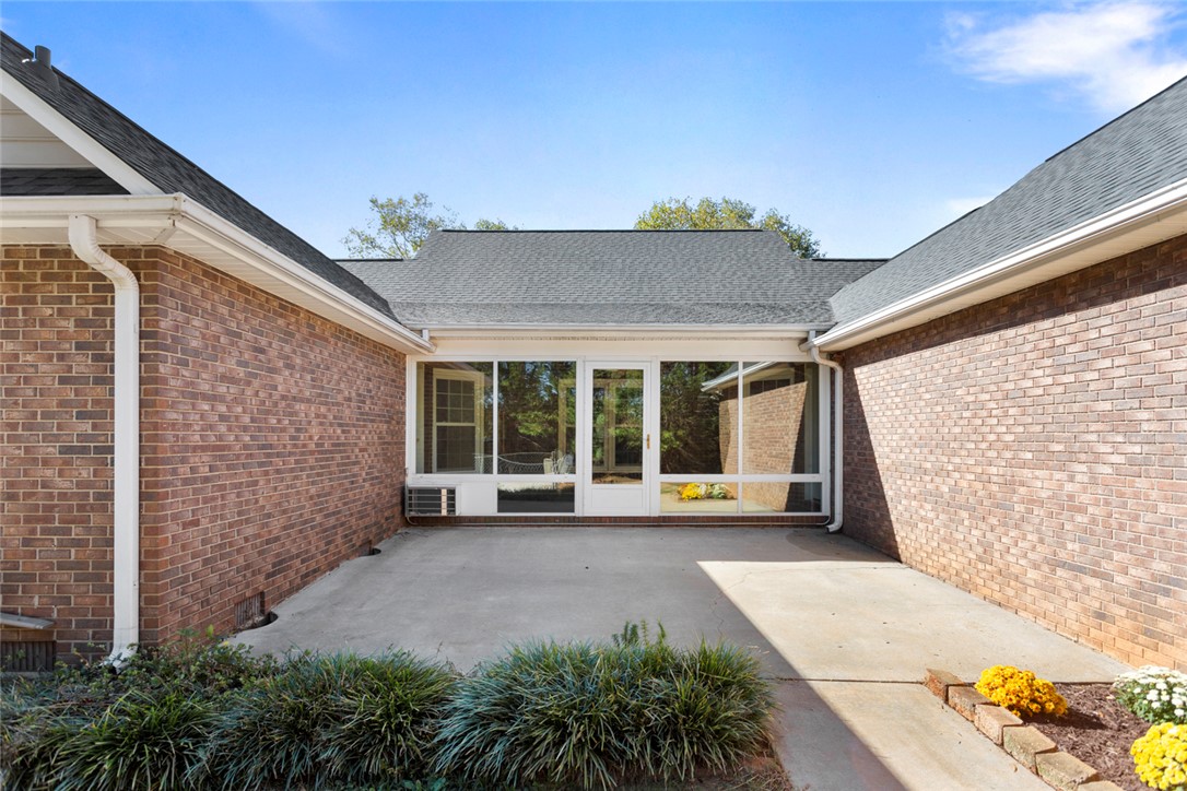 108 Ora Lane Anderson, SC 29625 - Photo 37 of 40 This property features an inviting sunroom, perfect for enjoying bright days and tranquil evenings.