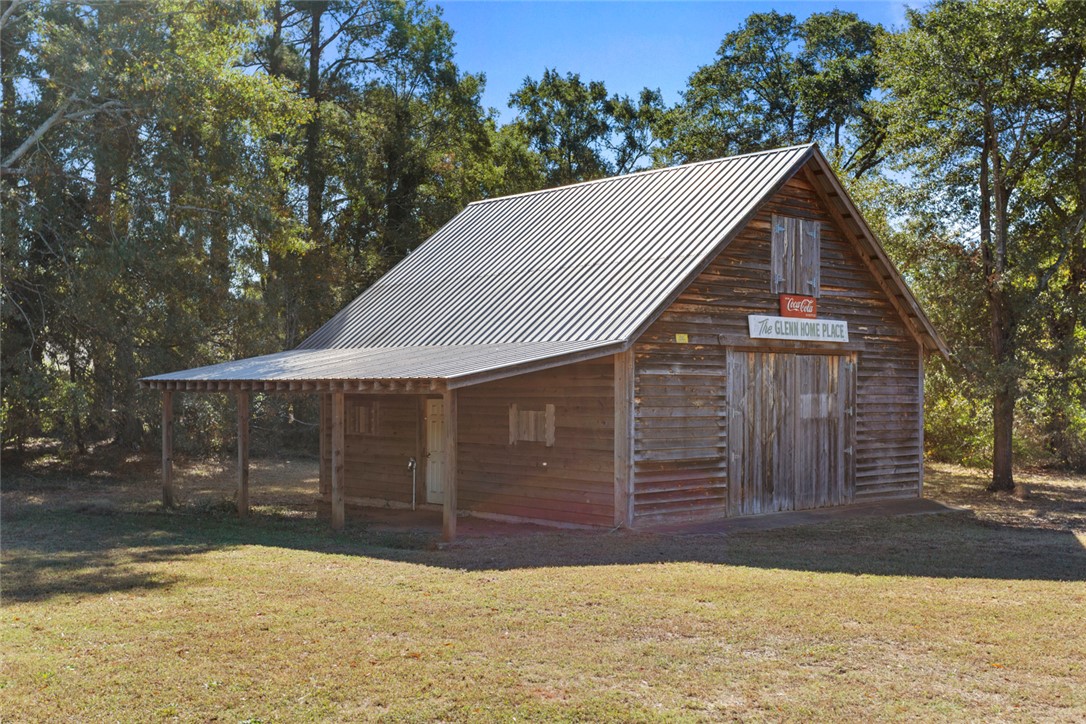 108 Ora Lane Anderson, SC 29625 - Photo 39 of 40 This charming barn offers rustic appeal with a functional covered porch.