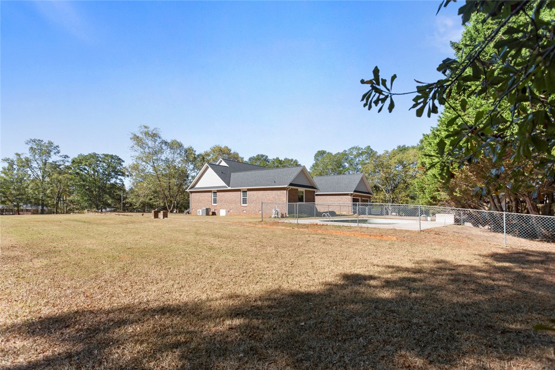 108 Ora Lane Anderson, SC 29625 - Photo 4 of 40 Expansive outdoor living with a private pool, perfect for leisure and recreation.