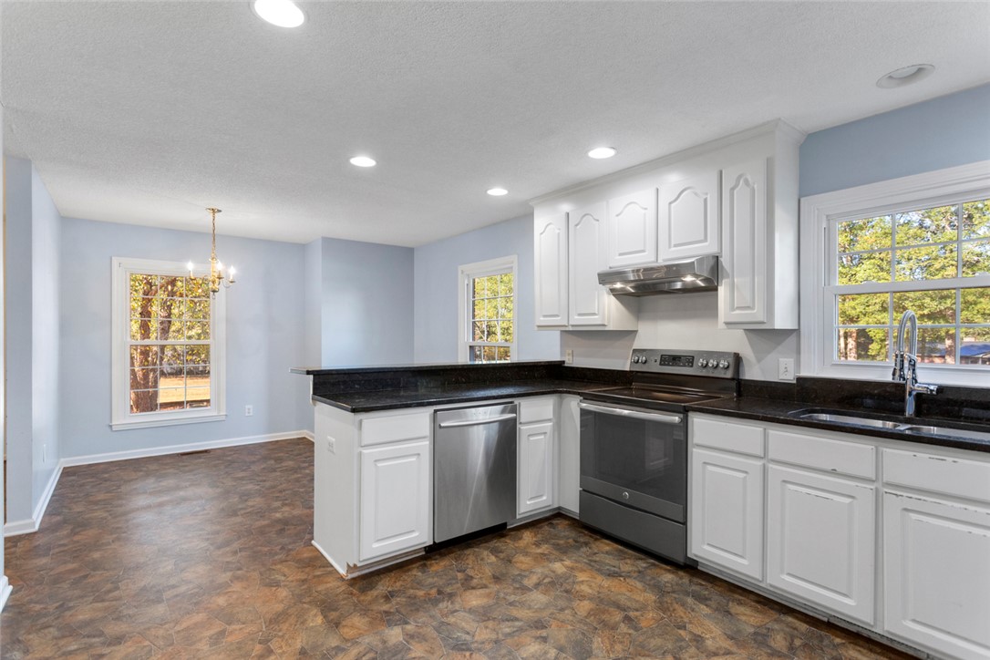 108 Ora Lane Anderson, SC 29625 - Photo 9 of 40 Bright and inviting kitchen and dining area with contemporary finishes.