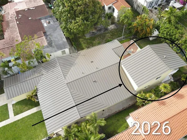 a view of a backyard with sitting area