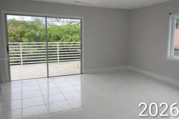 a view of a room with a large window