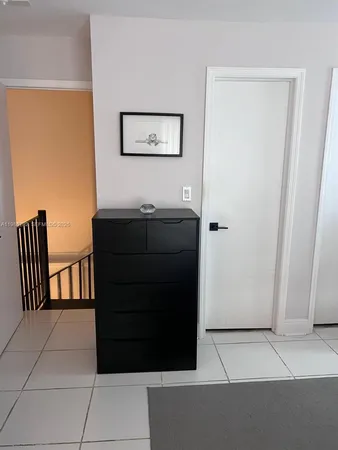 a view of a hallway with front door