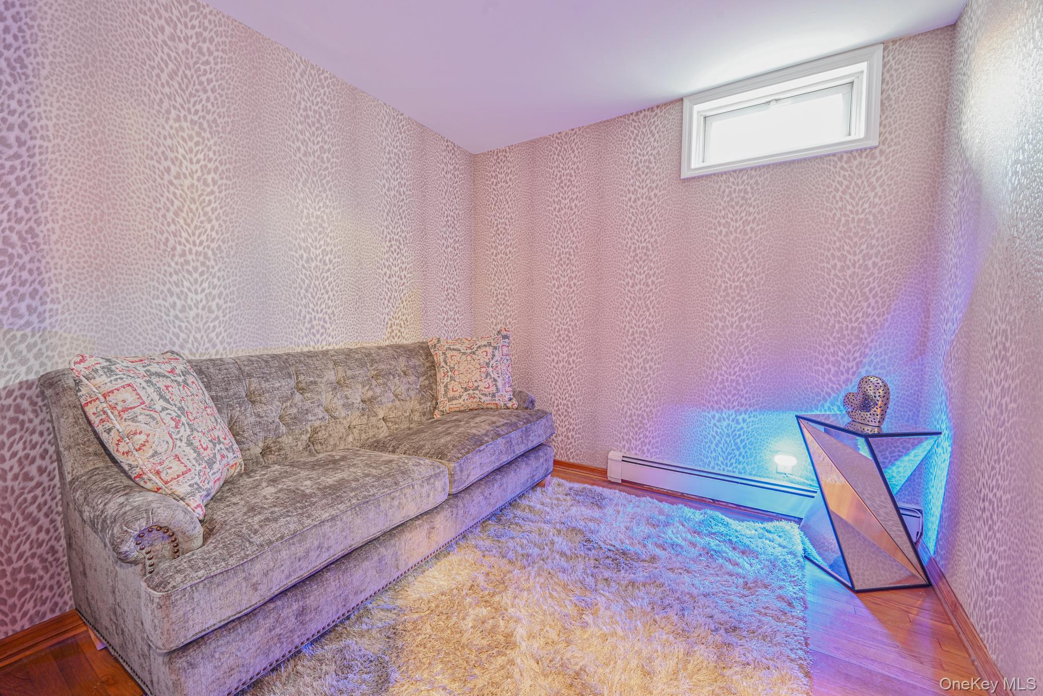 102-01 62nd Road Queens, NY 11375 - Photo 12 of 25 a living room with furniture and a wooden floor
