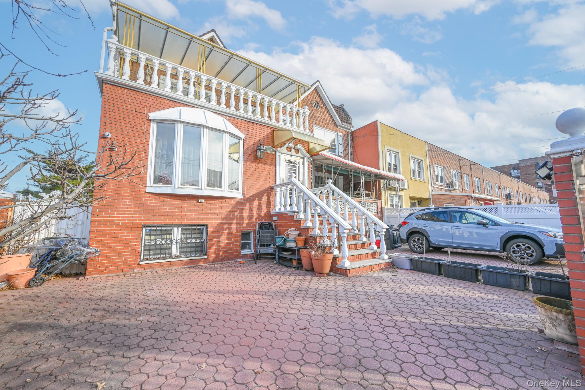 102-01 62nd Road Queens, NY 11375 - Photo 25 of 25 a front view of a building with parking space