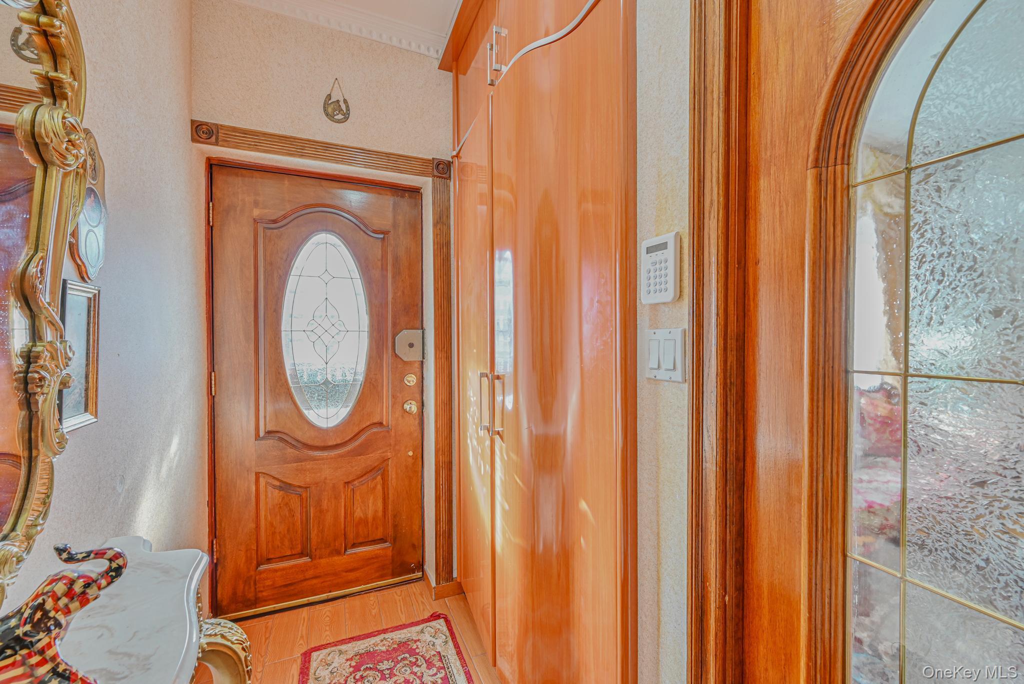 102-01 62nd Road Queens, NY 11375 - Photo 3 of 25 a view of a hallway with washer and dryer