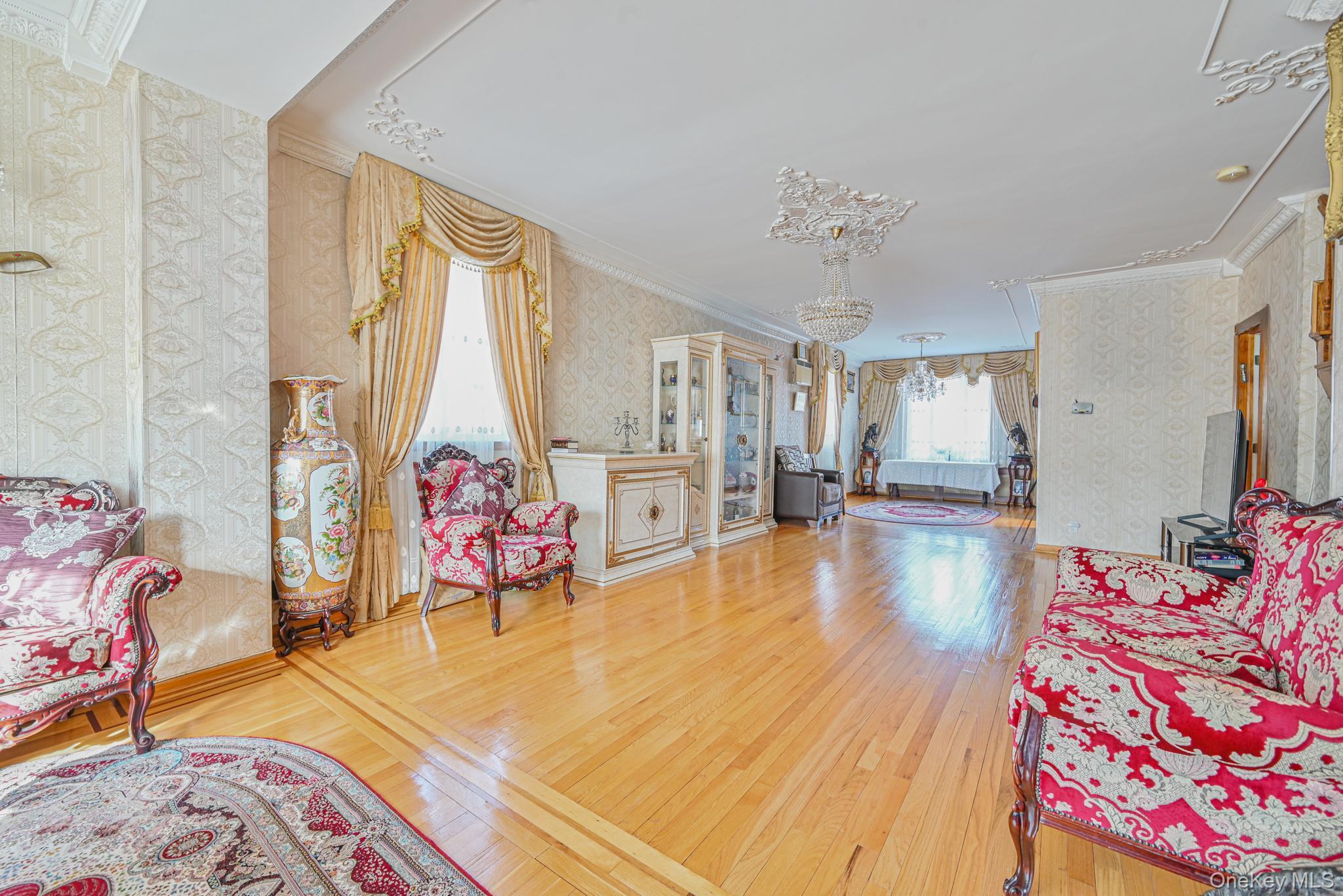 102-01 62nd Road Queens, NY 11375 - Photo 4 of 25 a view of a bedroom with bed and ceiling fan