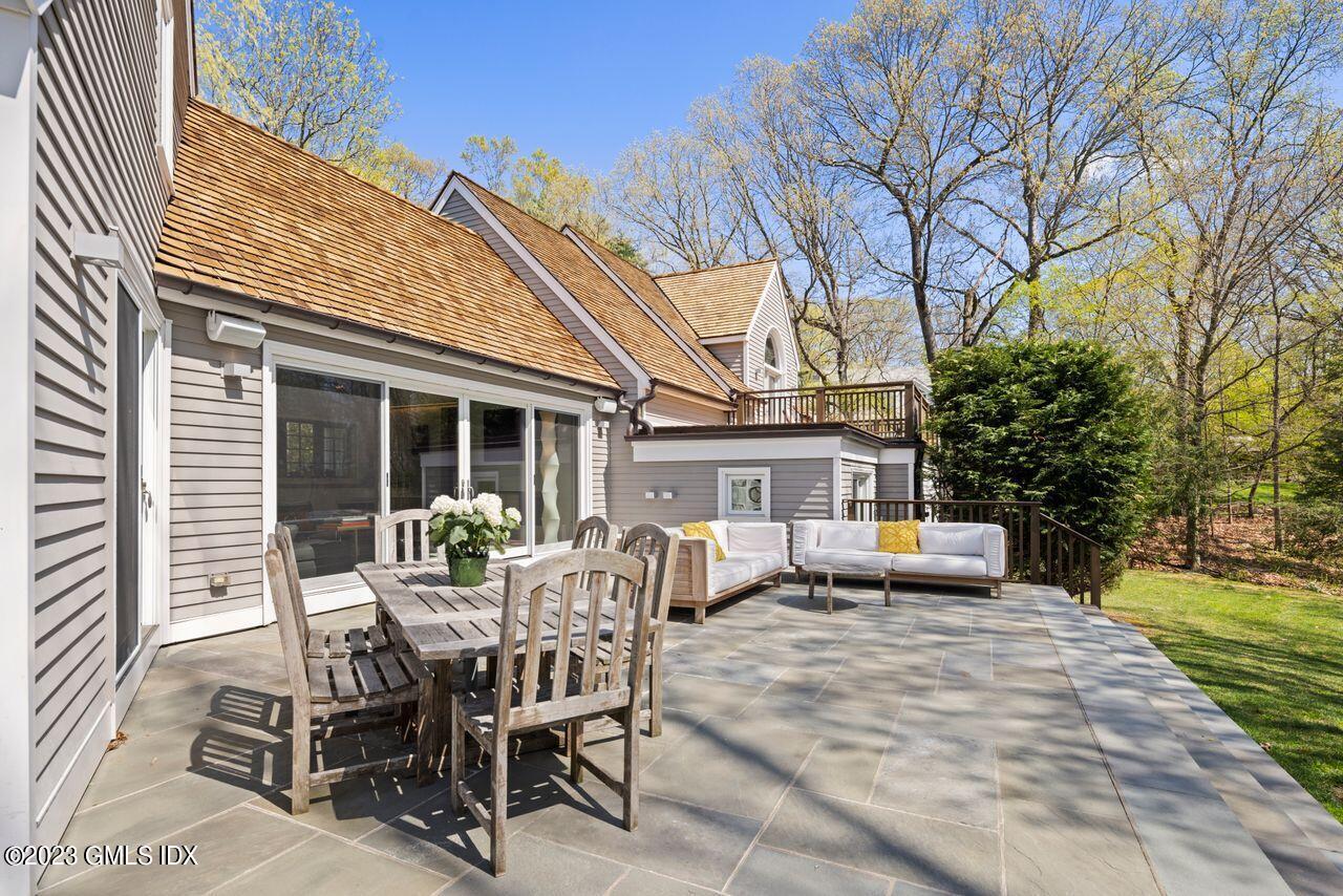 66 North Old Stone Bridge Road Cos Cob, CT 06807 - Photo 54 of 60 a view of a house with backyard and sitting area
