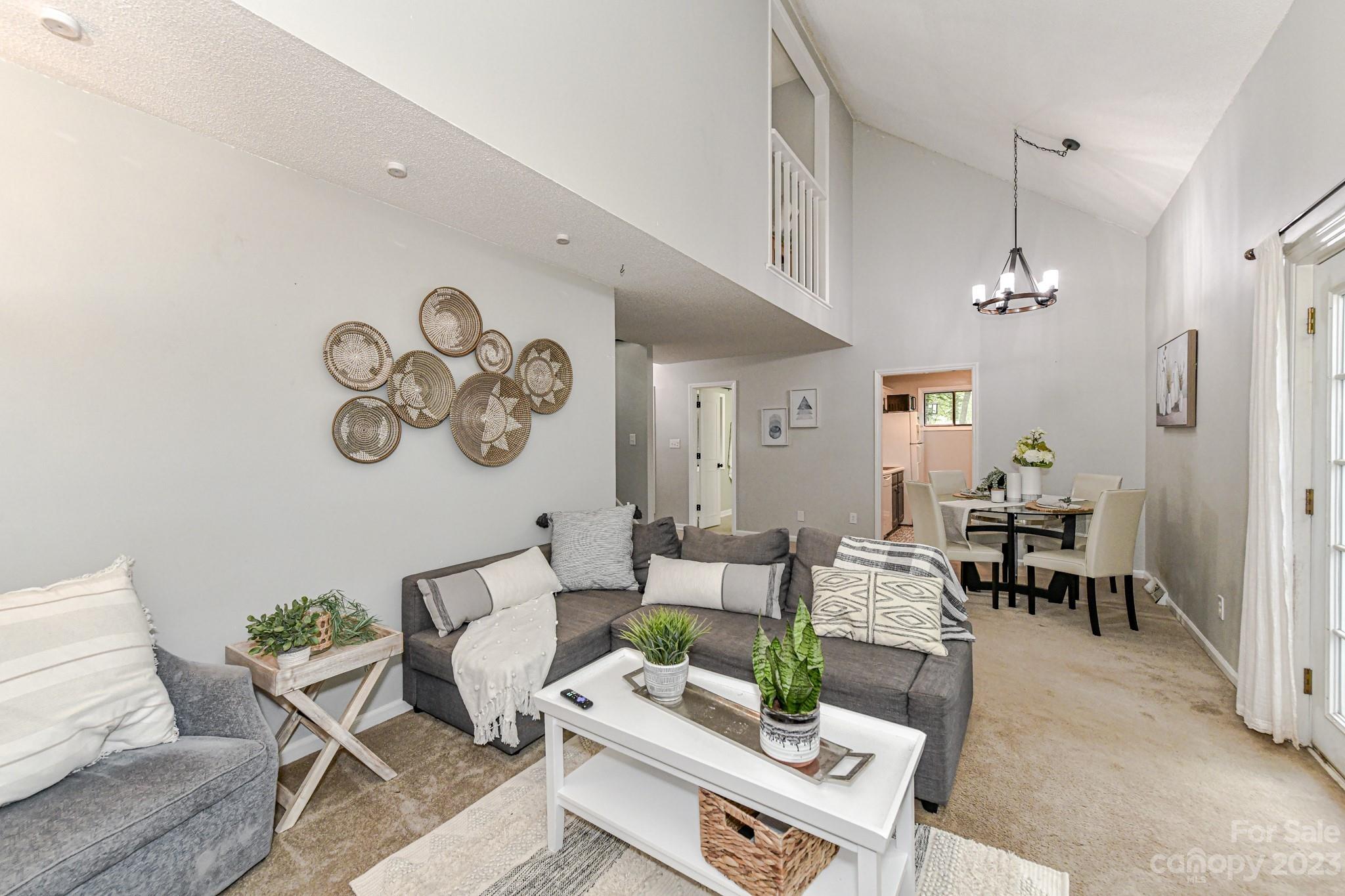 27046 Tidal Way Tega Cay, SC 29708 - Photo 5 of 20 a living room with furniture and a table