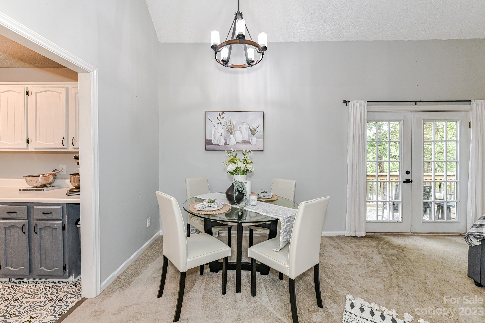 27046 Tidal Way Tega Cay, SC 29708 - Photo 6 of 20 a view of a dining room with furniture window and outside view