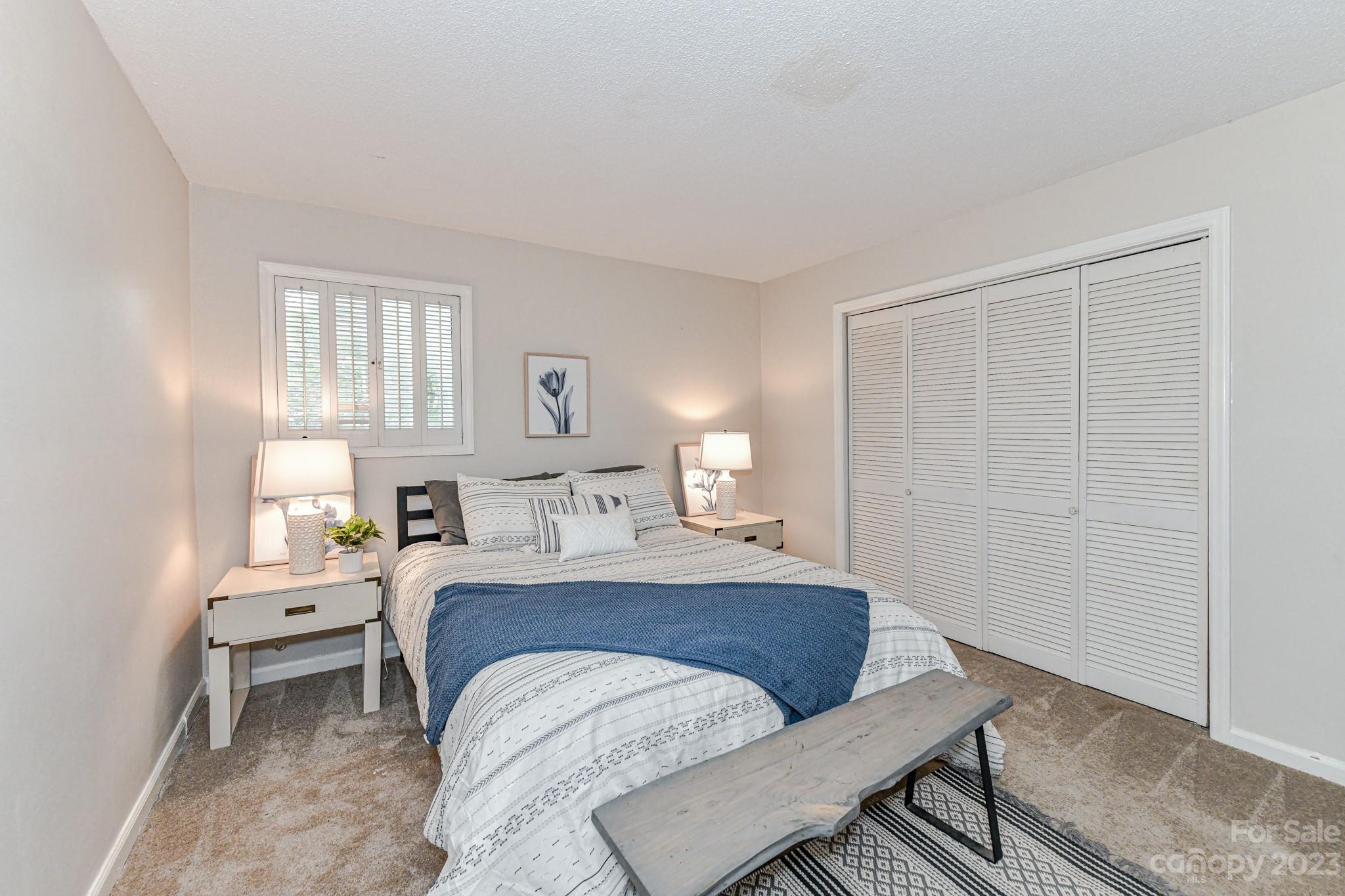 27046 Tidal Way Tega Cay, SC 29708 - Photo 9 of 20 a bedroom with a bed and window