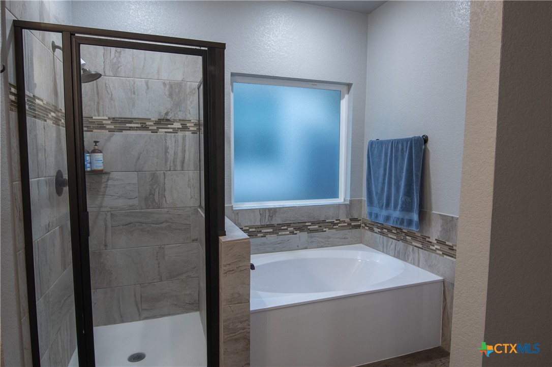 7909 McCulloch Road Temple, TX 76502 - Photo 37 of 46 a bathroom with a sink and a shower