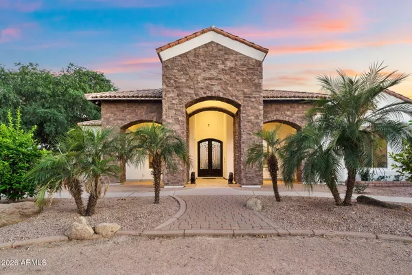 a spacious bedroom with a bed and a fireplace