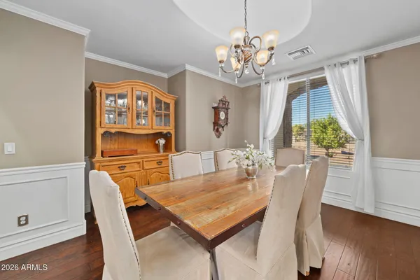 a bathroom with a granite countertop sink toilet and a mirror