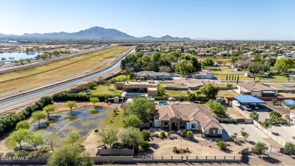 an aerial view of a house with a yard and garden