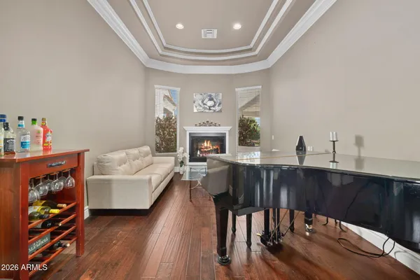 a spacious bathroom with a granite countertop toilet a sink and a mirror