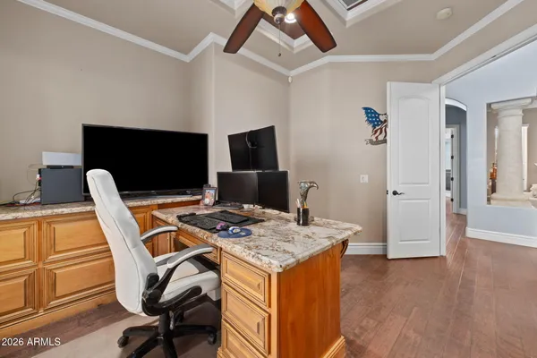 a bathroom with a granite countertop sink a toilet and a shower