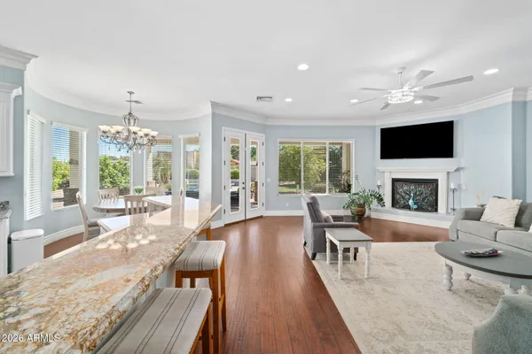 a bathroom with a granite countertop sink mirror vanity and toilet