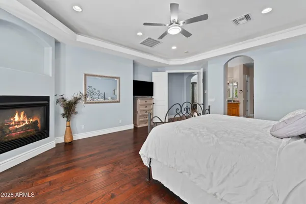 a view of house with swimming pool and sitting area