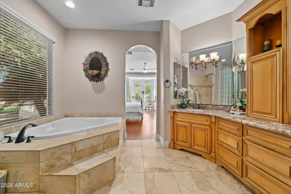 a view of patio with lawn chairs