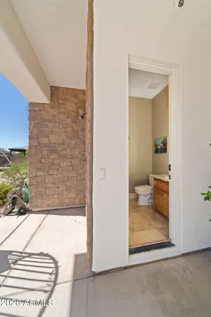 an aerial view of residential houses with outdoor space and swimming pool