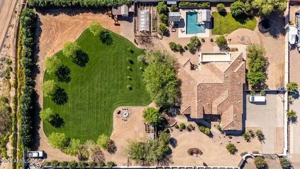 a view of a parking space in a backyard
