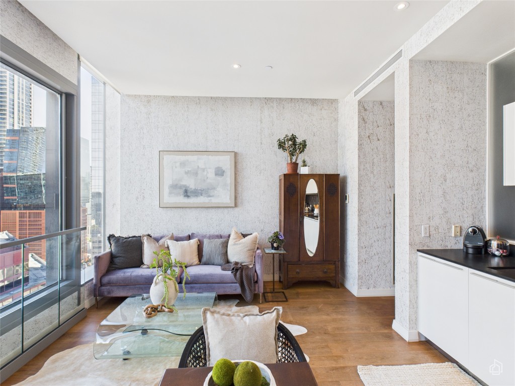210 Lavaca Street, Unit 1809 Austin, TX 78701 - Photo 16 of 32 Living area with light wood-style flooring, wallpapered walls, and recessed lighting